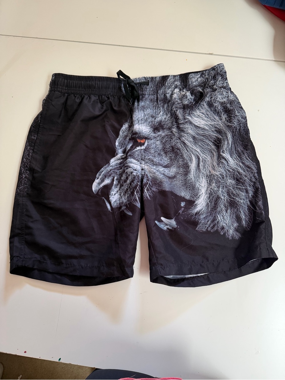 Black Men's Swim Board Shorts with Dramatic Lion Print